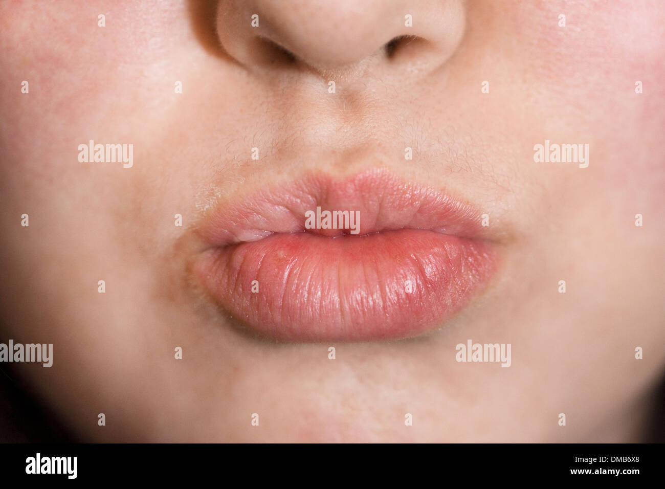 A human mouth ready to kiss Stock Photo