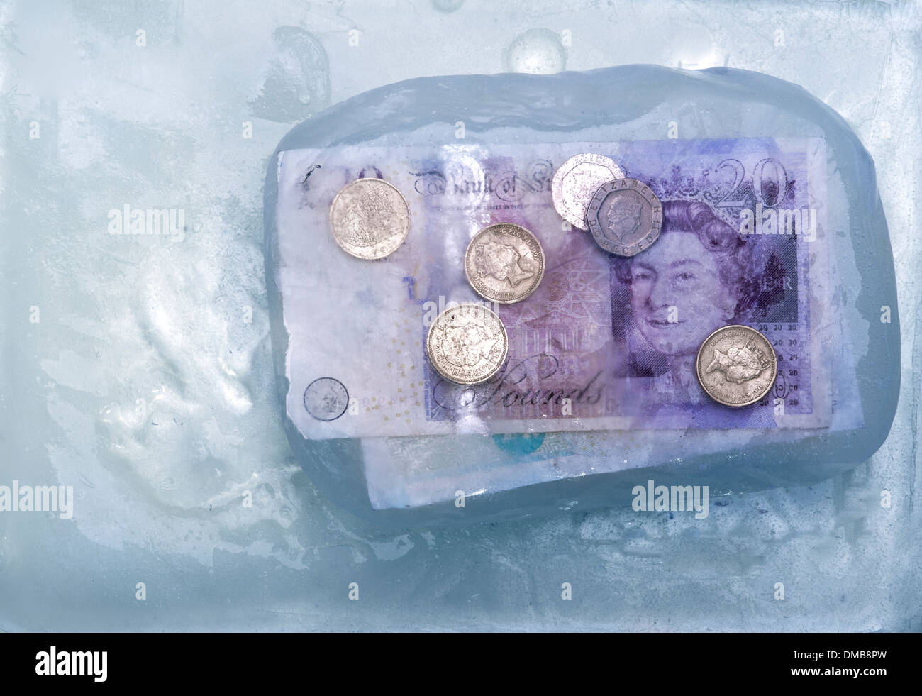 Money suspended in ice.Frozen assets. Stock Photo