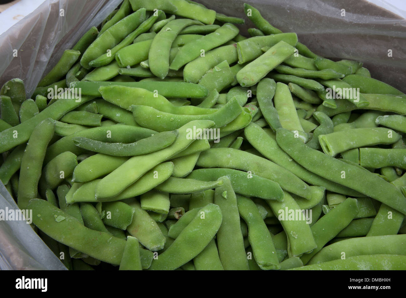 Frozen peas beans lettuce cabbage products laid on ice to be showcased