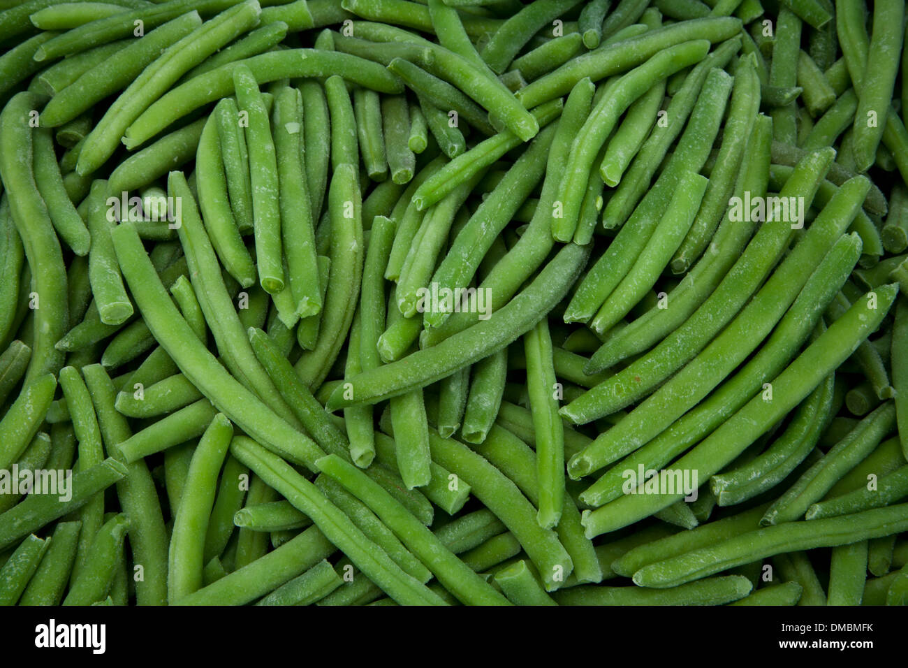 Frozen peas beans lettuce cabbage products laid on ice to be showcased