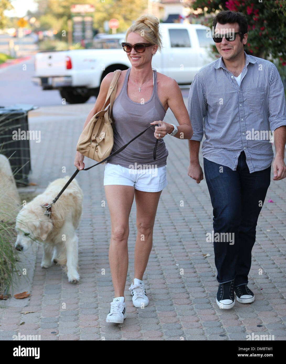 Nicollette Sheridan walking her Golden Retriever at Malibu Country Mart with a friend Los Angeles California - 18.08.12 Stock Photo