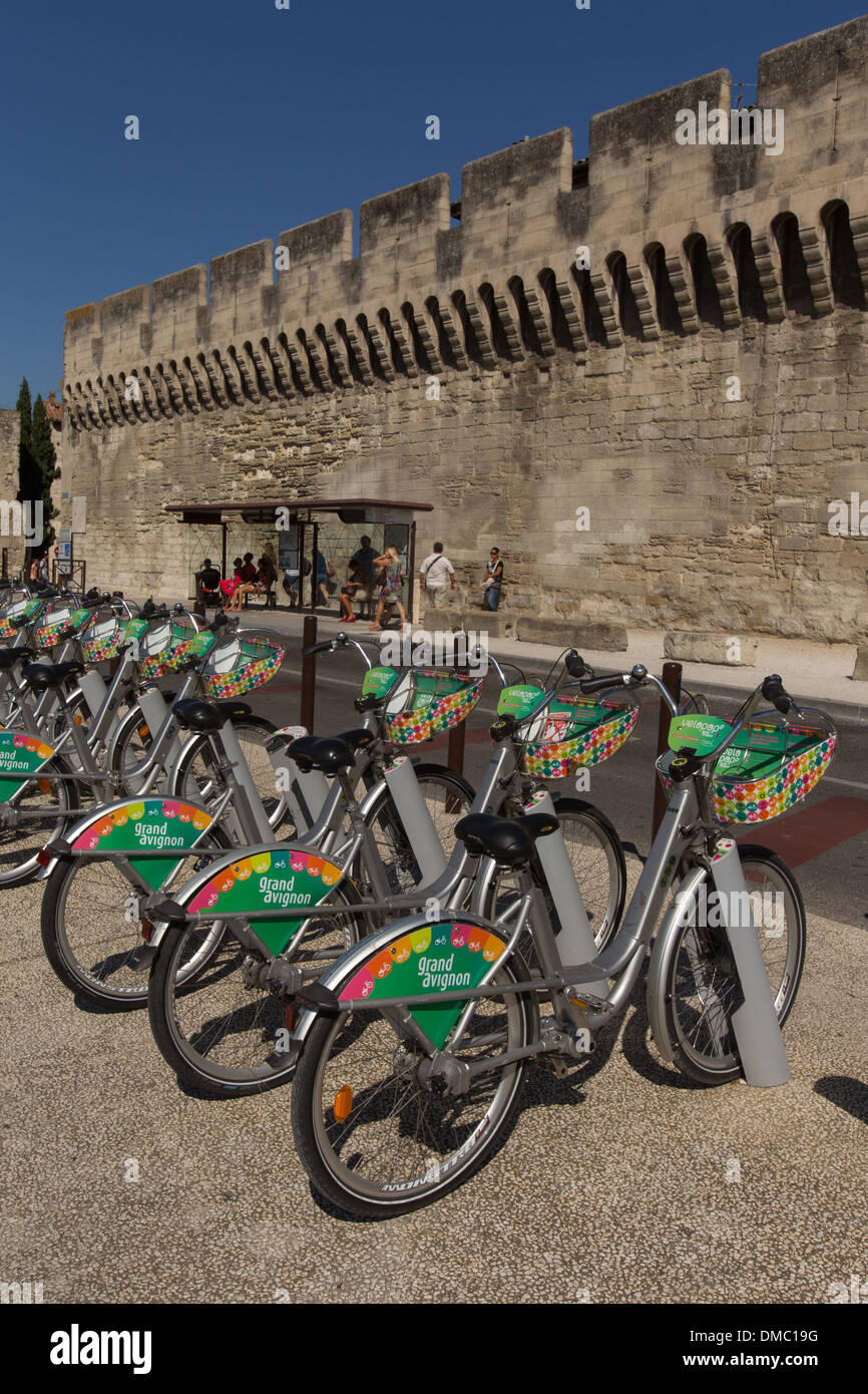VELOPOP, SELF-SERVE BICYCLES, AT THE FOOT OF THE 14TH CENTURY OULLE GATE  AND WALLS, CITY OF AVIGNON CALLED CITY OF THE POPES AND LISTED AS A WORLD  HERITAGE SITE BY UNESCO, VAUCLUSE (