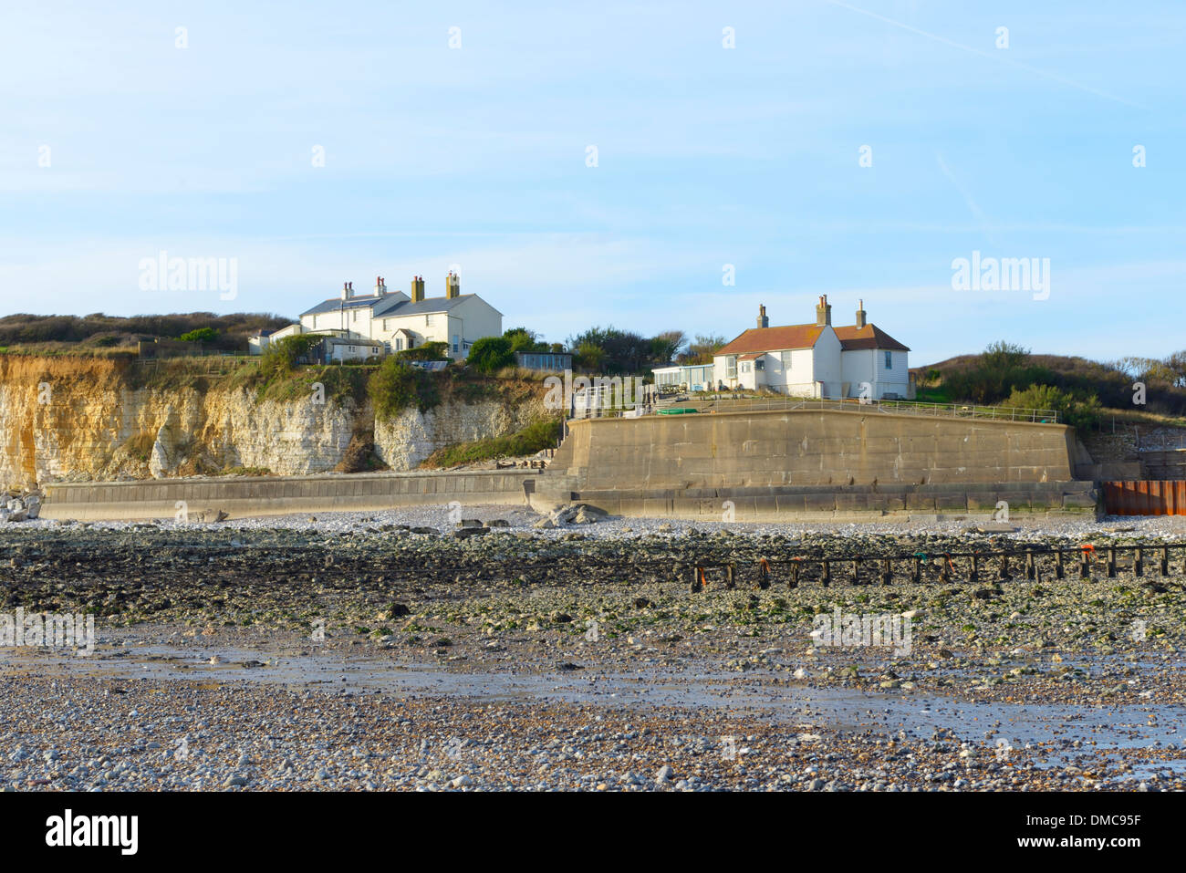 The Coastguard cottages at low tide at Cuckmere Haven, East Sussex, UK Stock Photo