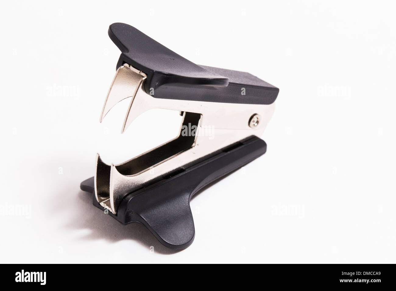 Staple remover on white Stock Photo Alamy