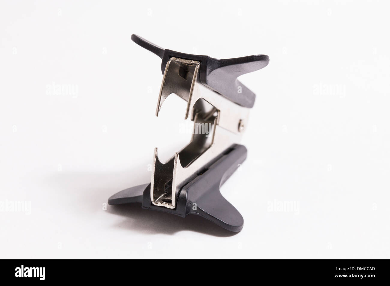 Staple remover on white Stock Photo