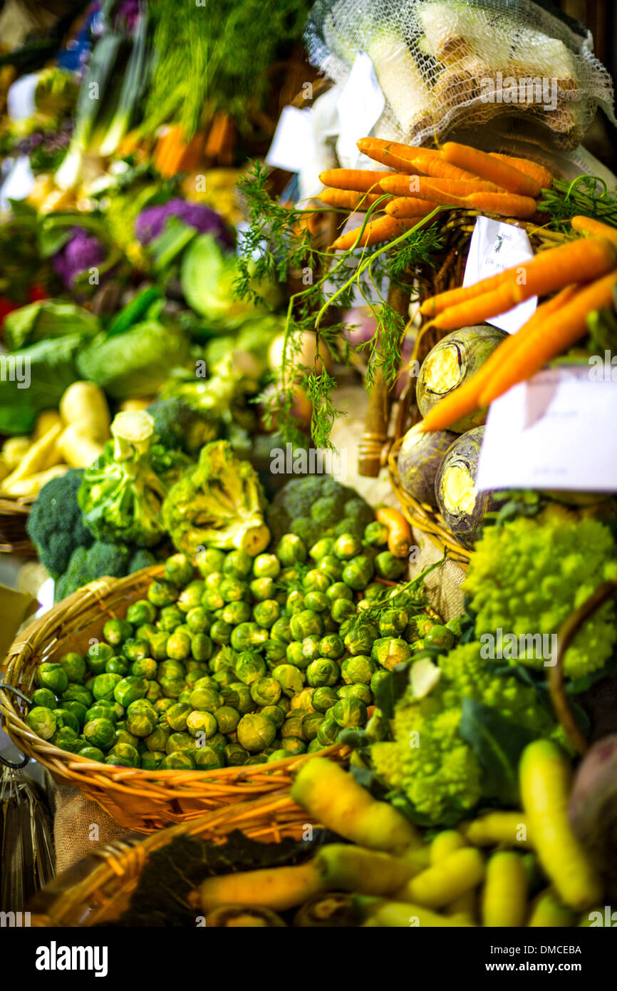 Seasonal vegetables on display at Borough Market. The display includes brussel spouts, carrots, broccoli and parsnips. Stock Photo