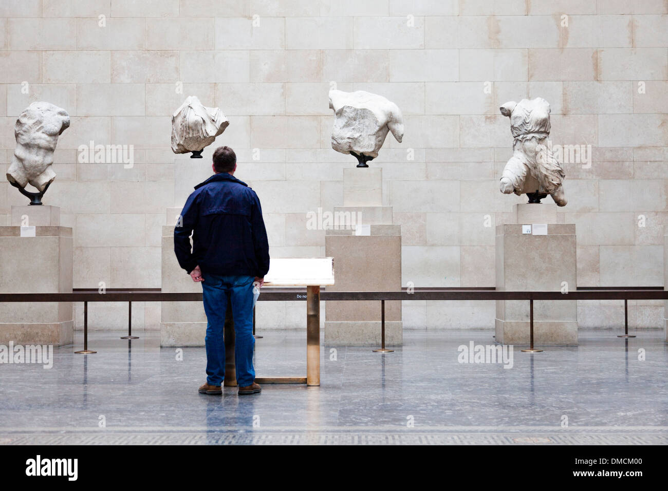 Man looks at Roman busts, British Museum, London Stock Photo