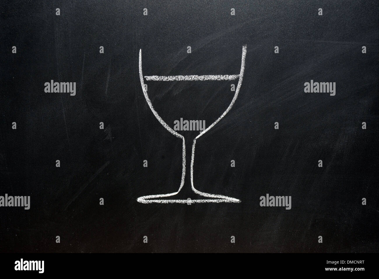 A picture of a wine glass drawn on a blackboard in white chalk Stock