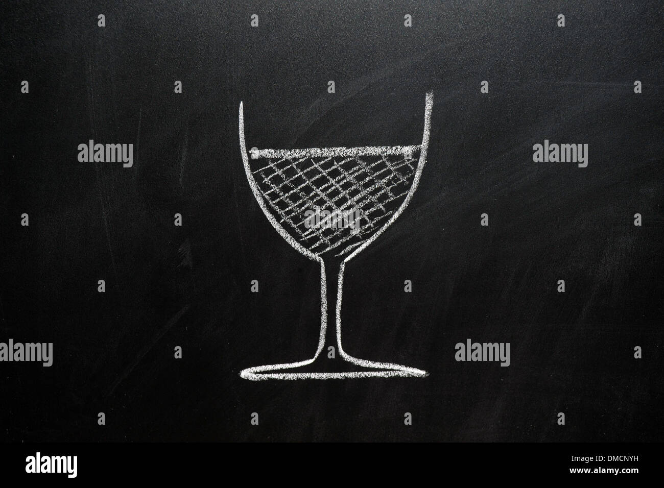 A picture of a glass of wine drawn on a blackboard in white chalk. Stock Photo