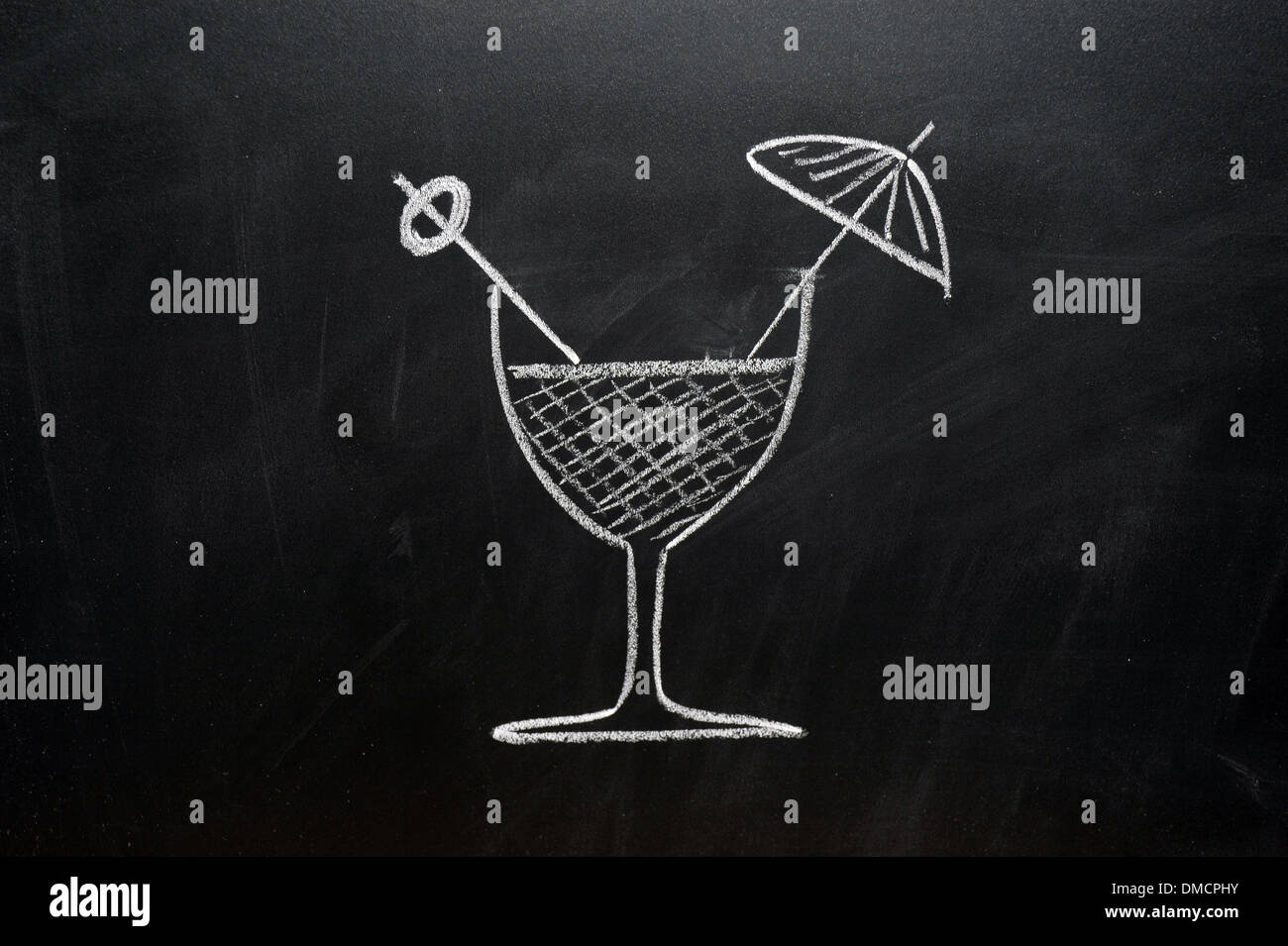 A picture of a cocktail drawn on a blackboard in white chalk. Stock Photo