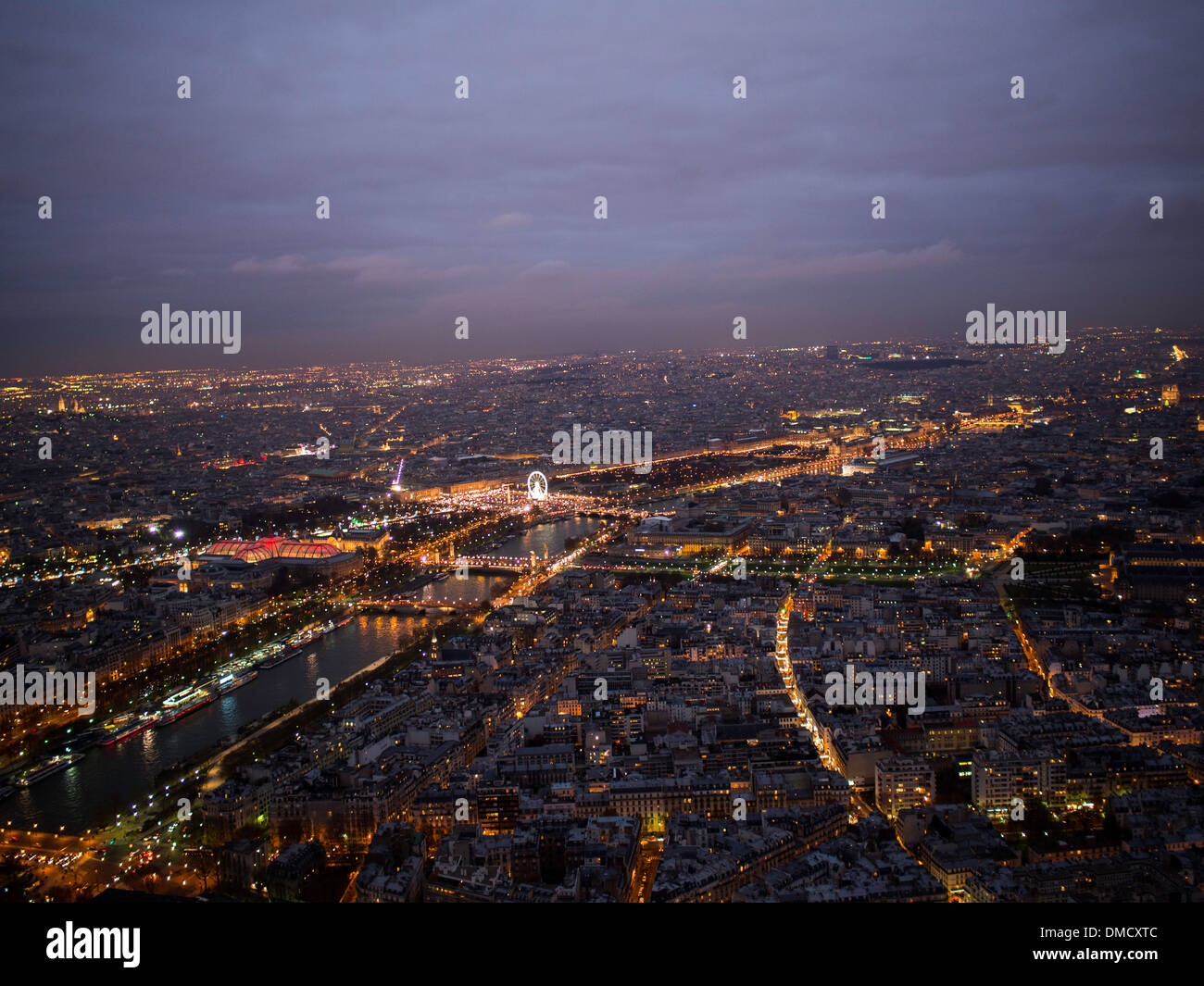 Night fall view of Paris and Seine river from the Eiffel tower top Stock Photo