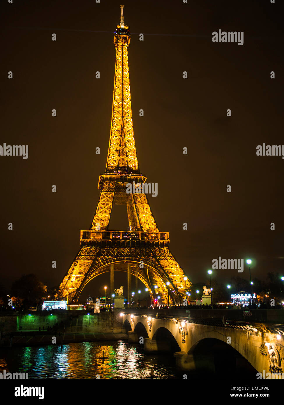 Eiffel tower and Seine river Iéna bridge at night Stock Photo