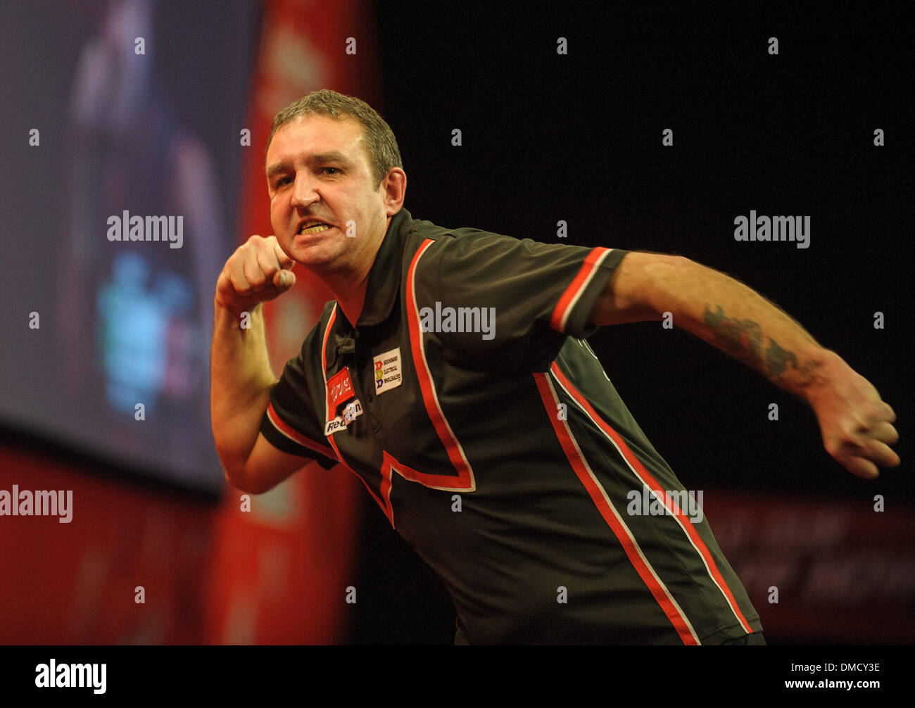 London, UK. 13th Dec, 2013. Richie Burnett (Wales) [28] celebrates his win over Dean Winstanley (England) in their first round match at The Ladbrokes World Darts Championships from Alexandra Palace. Credit:  Action Plus Sports/Alamy Live News Stock Photo