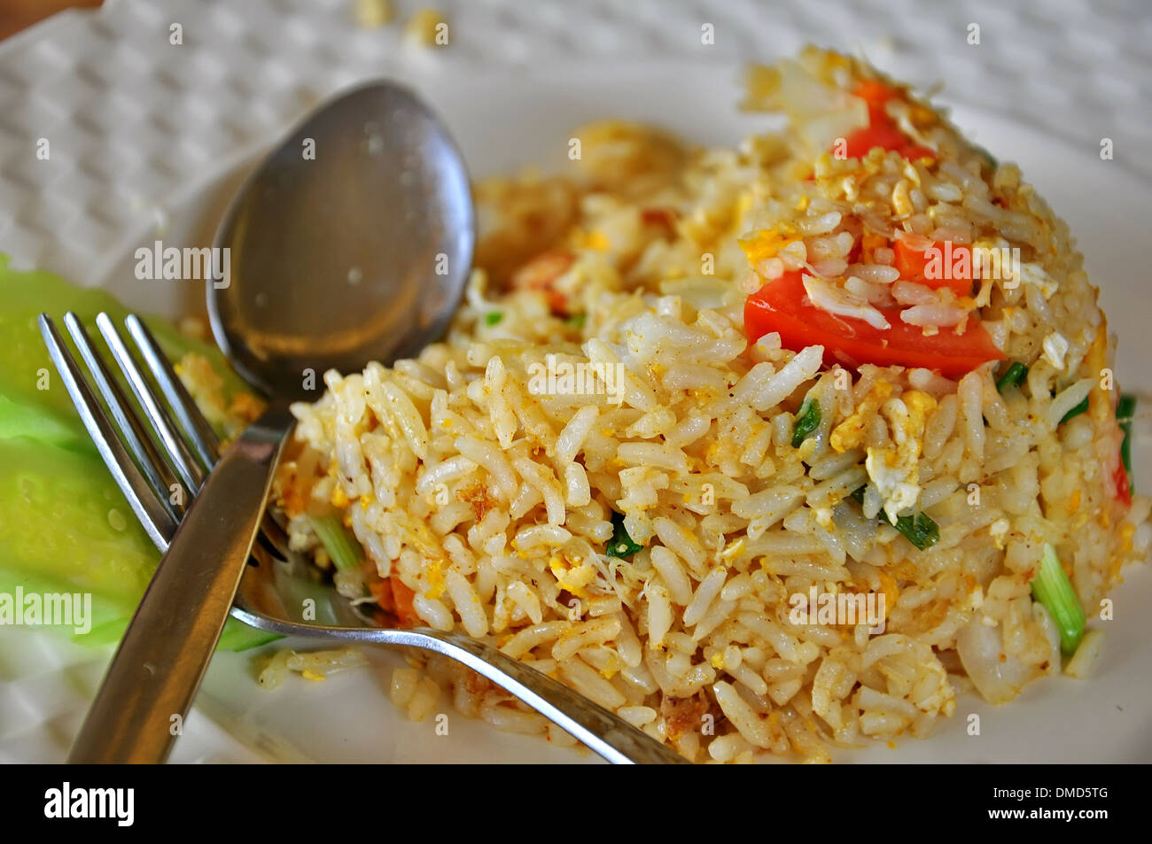 Fried rice with eggs and spoon and fork Stock Photo Alamy