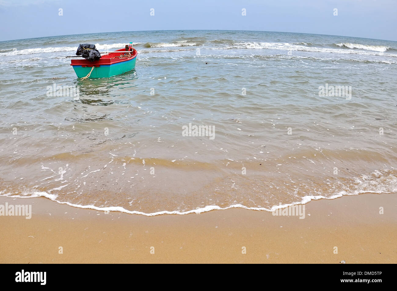 Old wooden fishing boat landing on the beach Stock Photo - Alamy