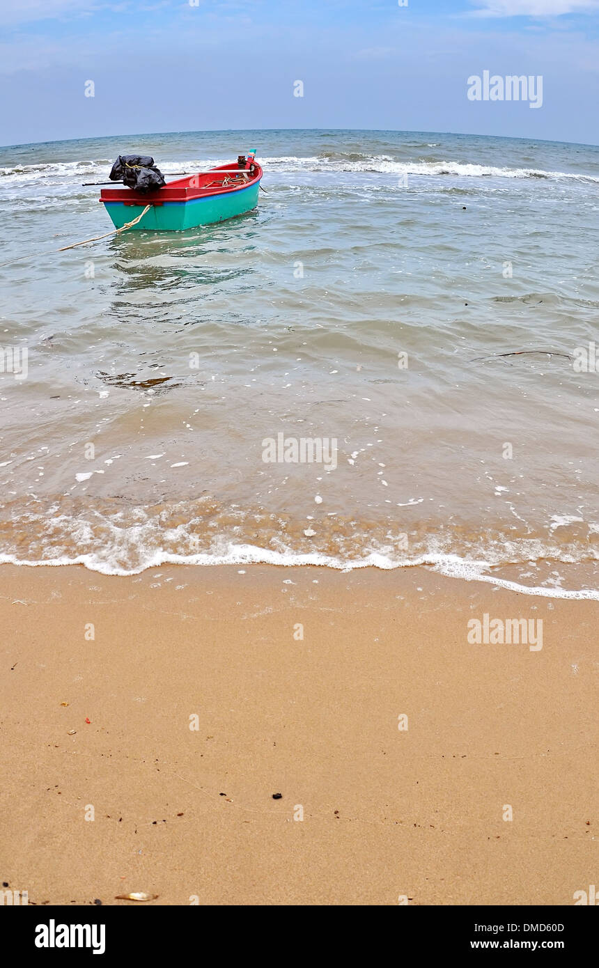 Old wooden fishing boat landing on the beach Stock Photo - Alamy