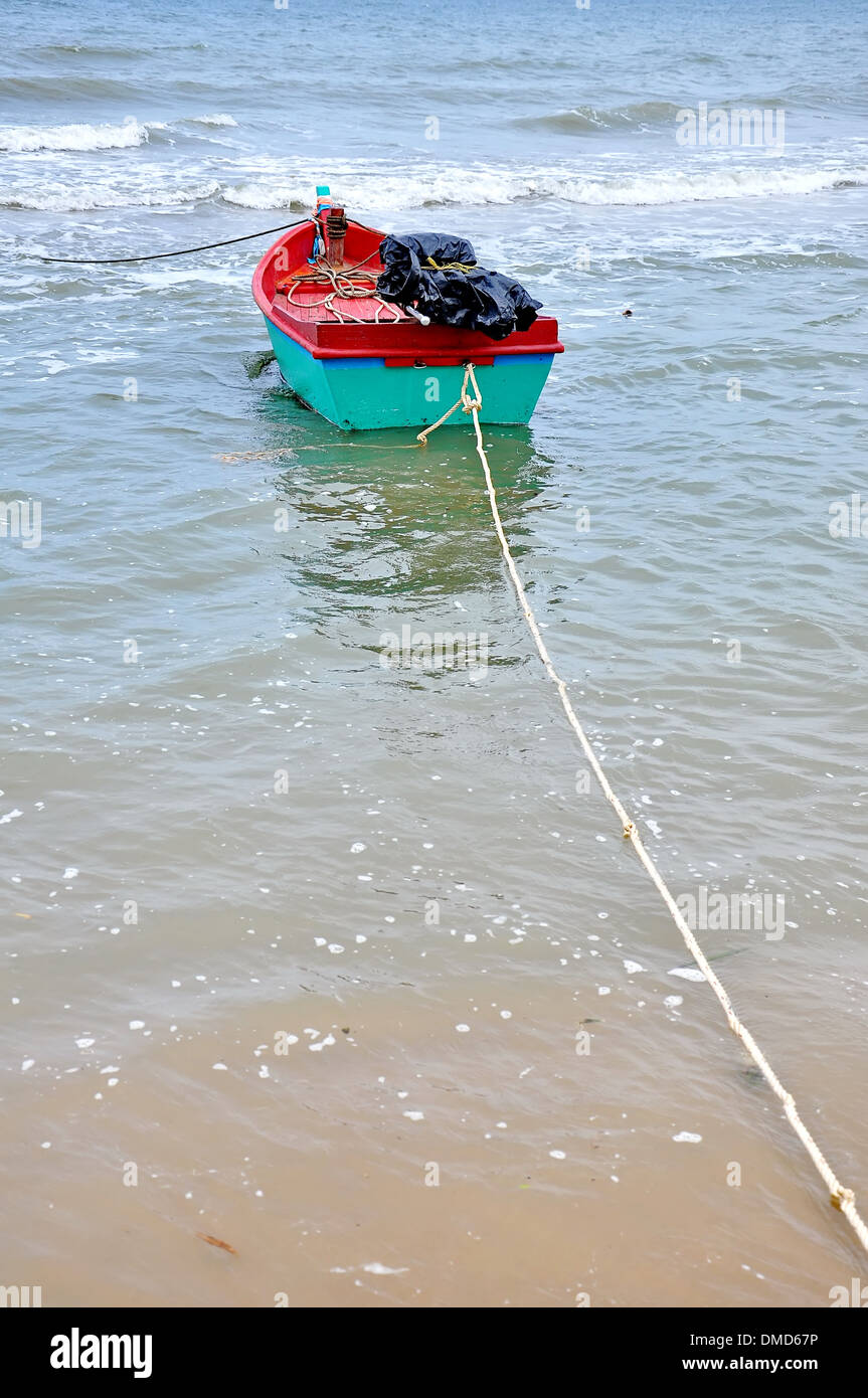 Old wooden fishing boat landing on the beach Stock Photo - Alamy