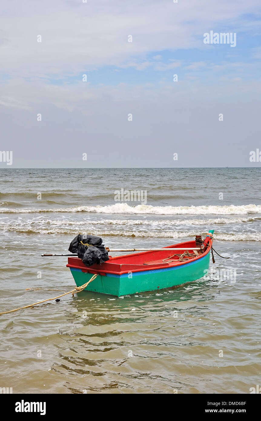 Old wooden fishing boat landing on the beach Stock Photo - Alamy
