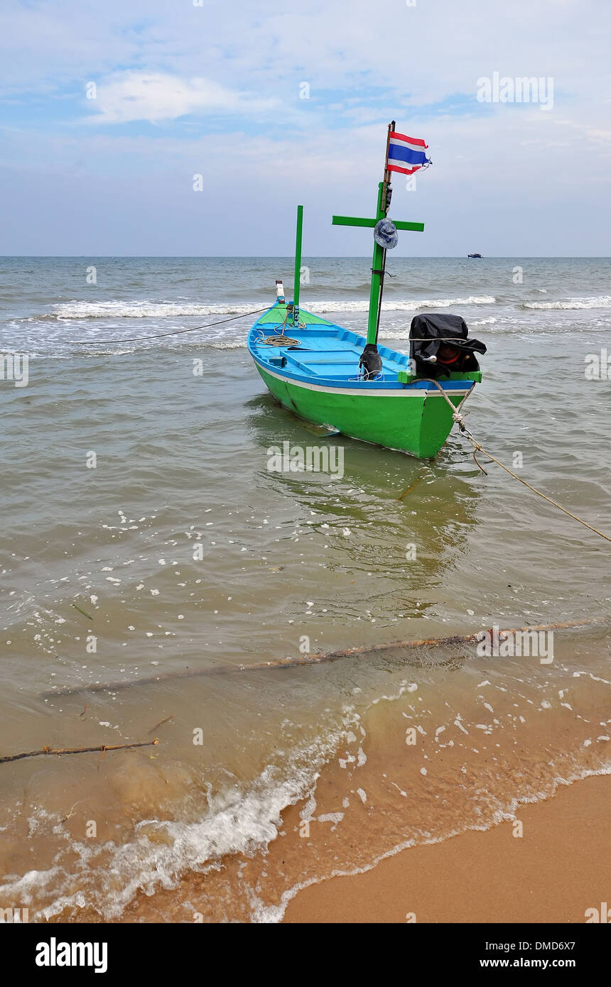 Old wooden fishing boat landing on the beach Stock Photo - Alamy