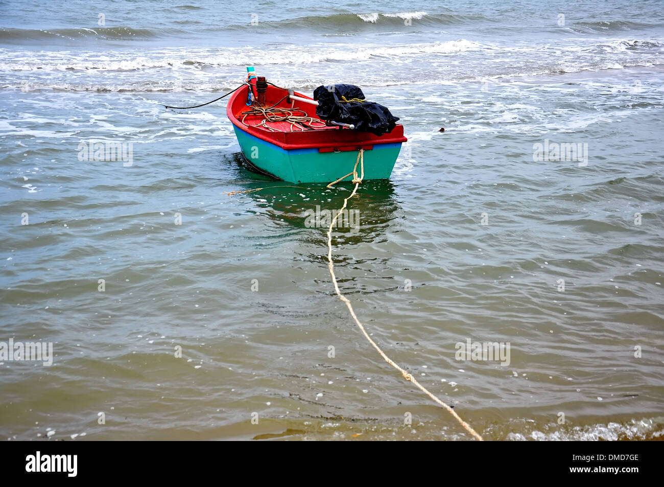 Old wooden fishing boat landing on the beach Stock Photo - Alamy