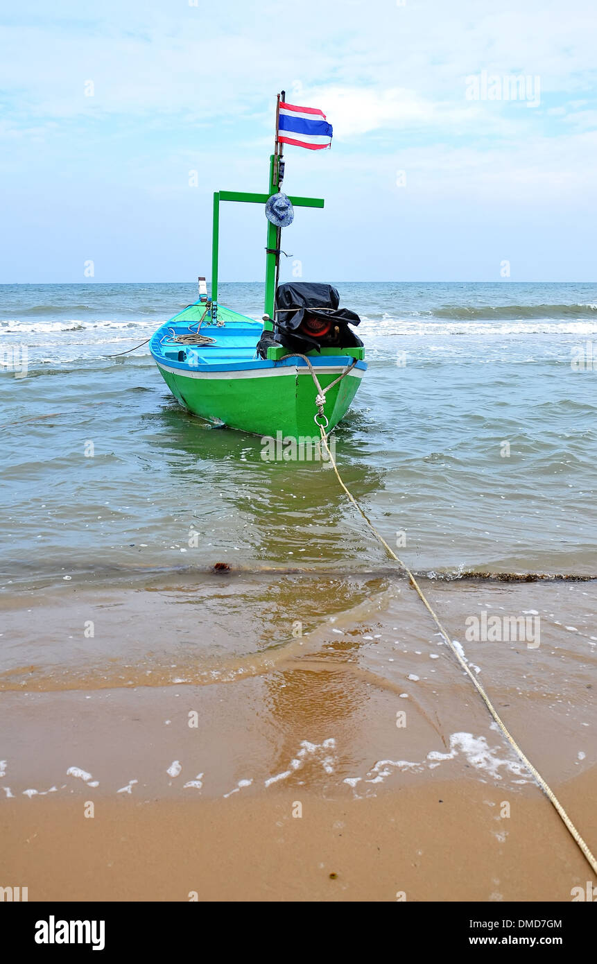 Old wooden fishing boat landing on the beach Stock Photo - Alamy