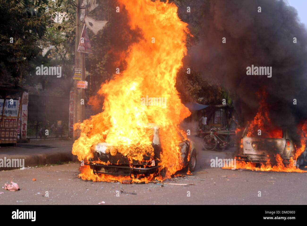 Dhaka, Bangladesh. 13th Dec, 2013. A car is set on fire by activists of Jamaat-e-Islami Party as they protest against the execution of their leader Abdul Quader Molla in Dhaka, Bangladesh, Dec. 13, 2013. Bangladesh has executed Abdul Quader Molla, an Islamist party leader convicted of war crimes in 1971, which is the first execution of a war criminal in the country. In protest against Molla's execution, his party Jamaat called countrywide dawn-to-dusk general strike for Sunday. Credit:  Shariful Islam/Xinhua/Alamy Live News Stock Photo