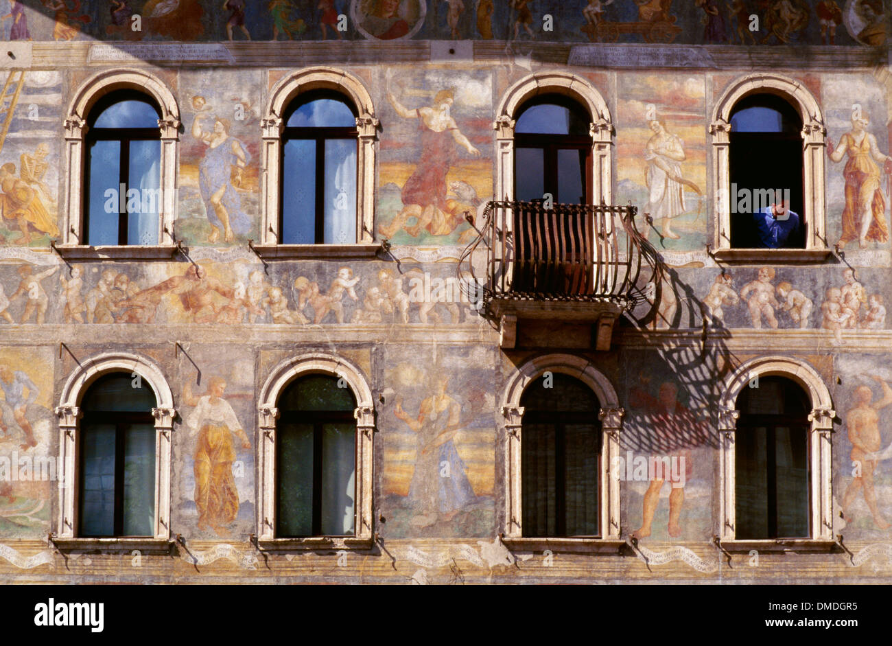 Frescoes on Case Cazuffi-Rella Trento (Trent) Italy with man looking out of window Stock Photo