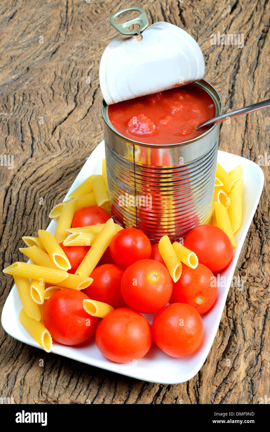 tomatoes in jar of aluminum ready for seasoning pasta Stock Photo Alamy