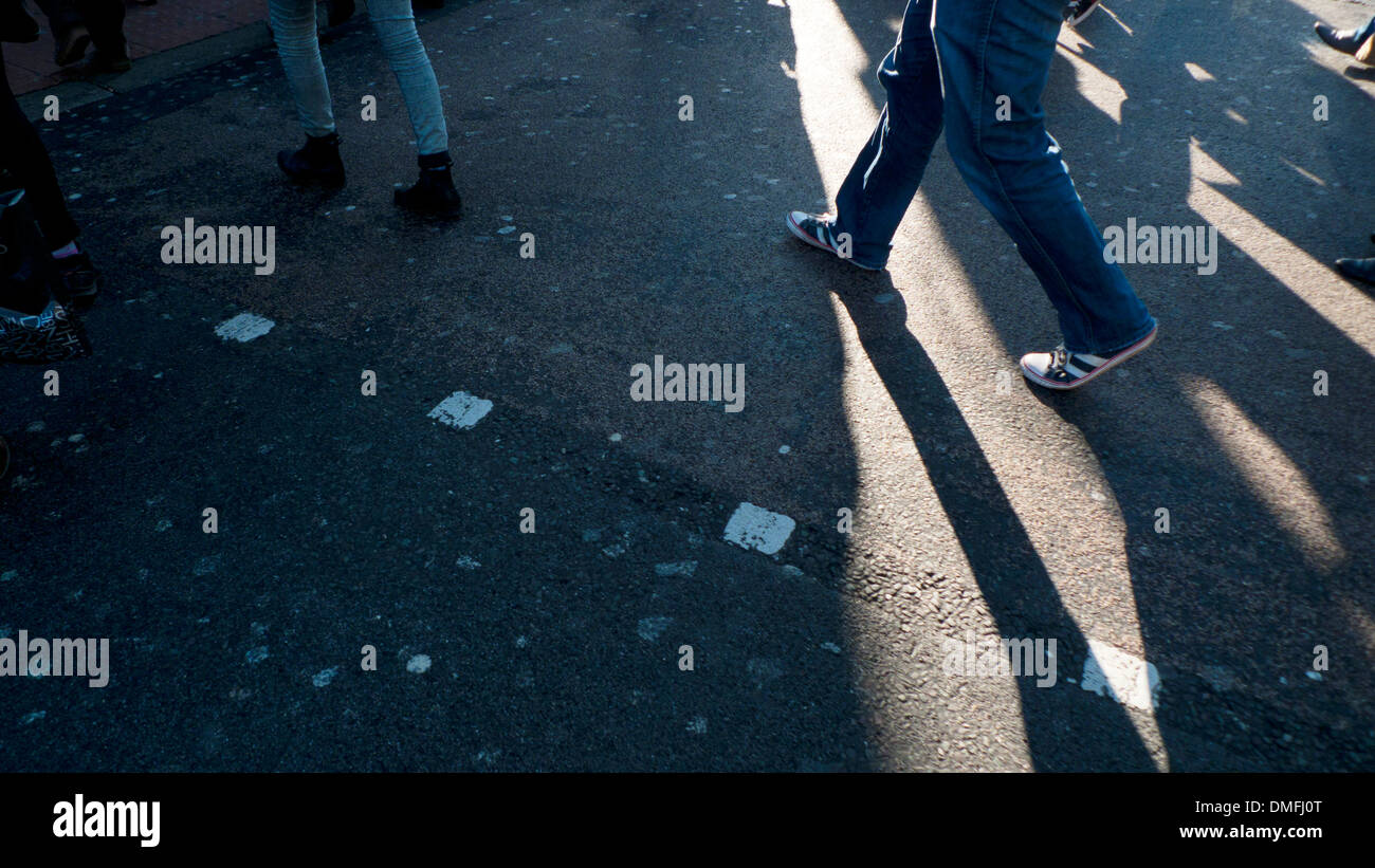 Pedestrians shadows on the pavement in London, England, UK  KATHY DEWITT Stock Photo