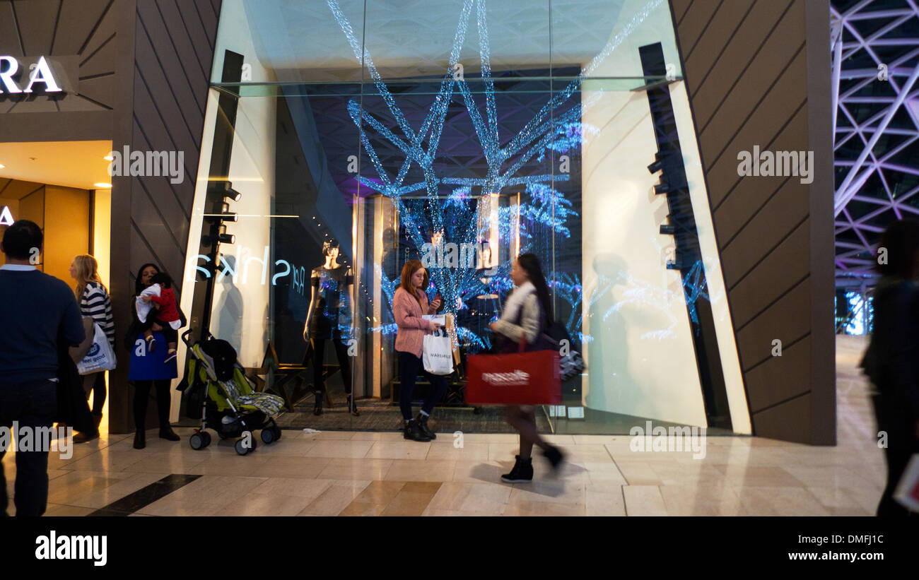 Shopper inside Westfield Shopping Mall in Shepherd's Bush West London England UK  KATHY DEWITT Stock Photo