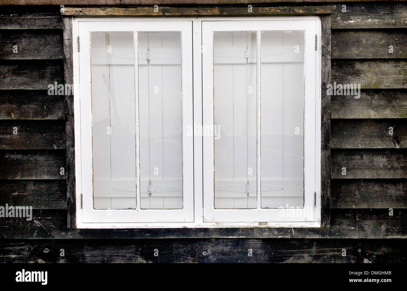 Closed Window With Wooden Interior Shutters Stock Photo