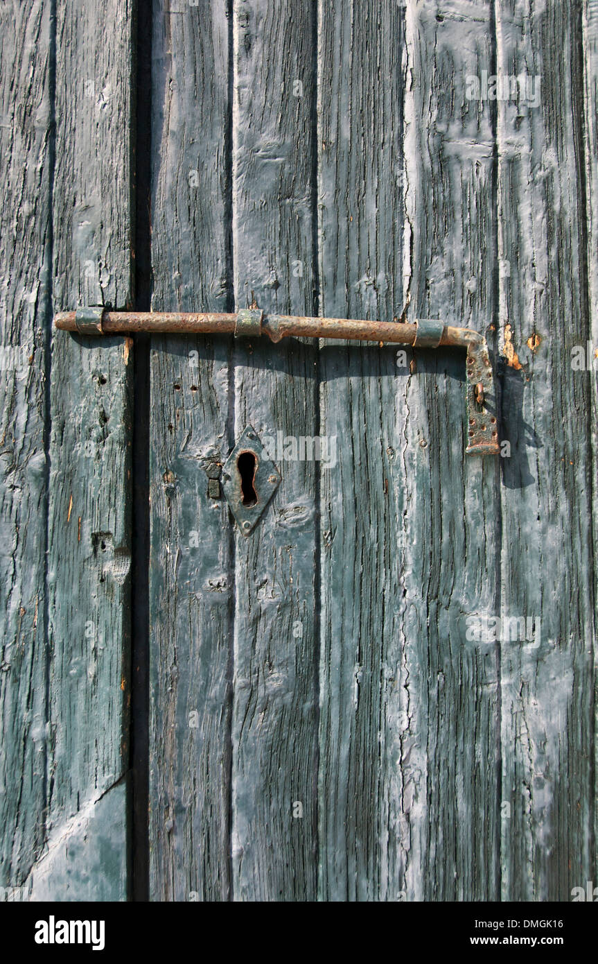 An old wooden door with a lock Stock Photo - Alamy