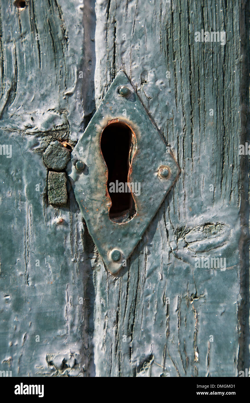 An old wooden door with a lock Stock Photo - Alamy
