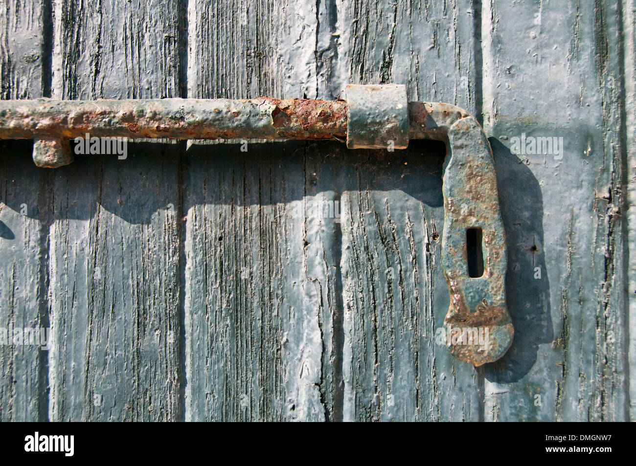 An old wooden door with a lock Stock Photo - Alamy