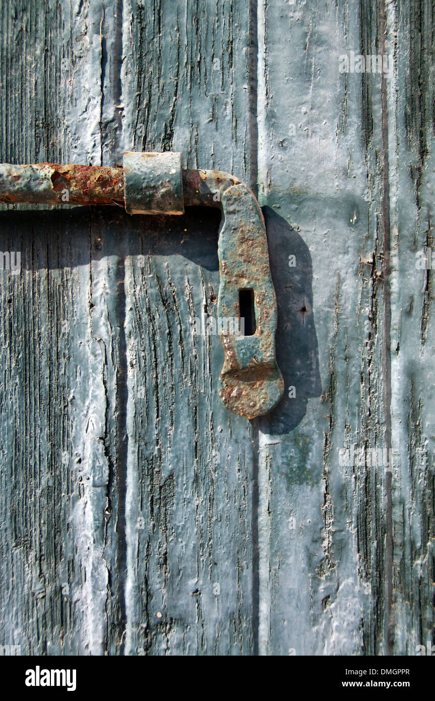 An old wooden door with a lock Stock Photo - Alamy
