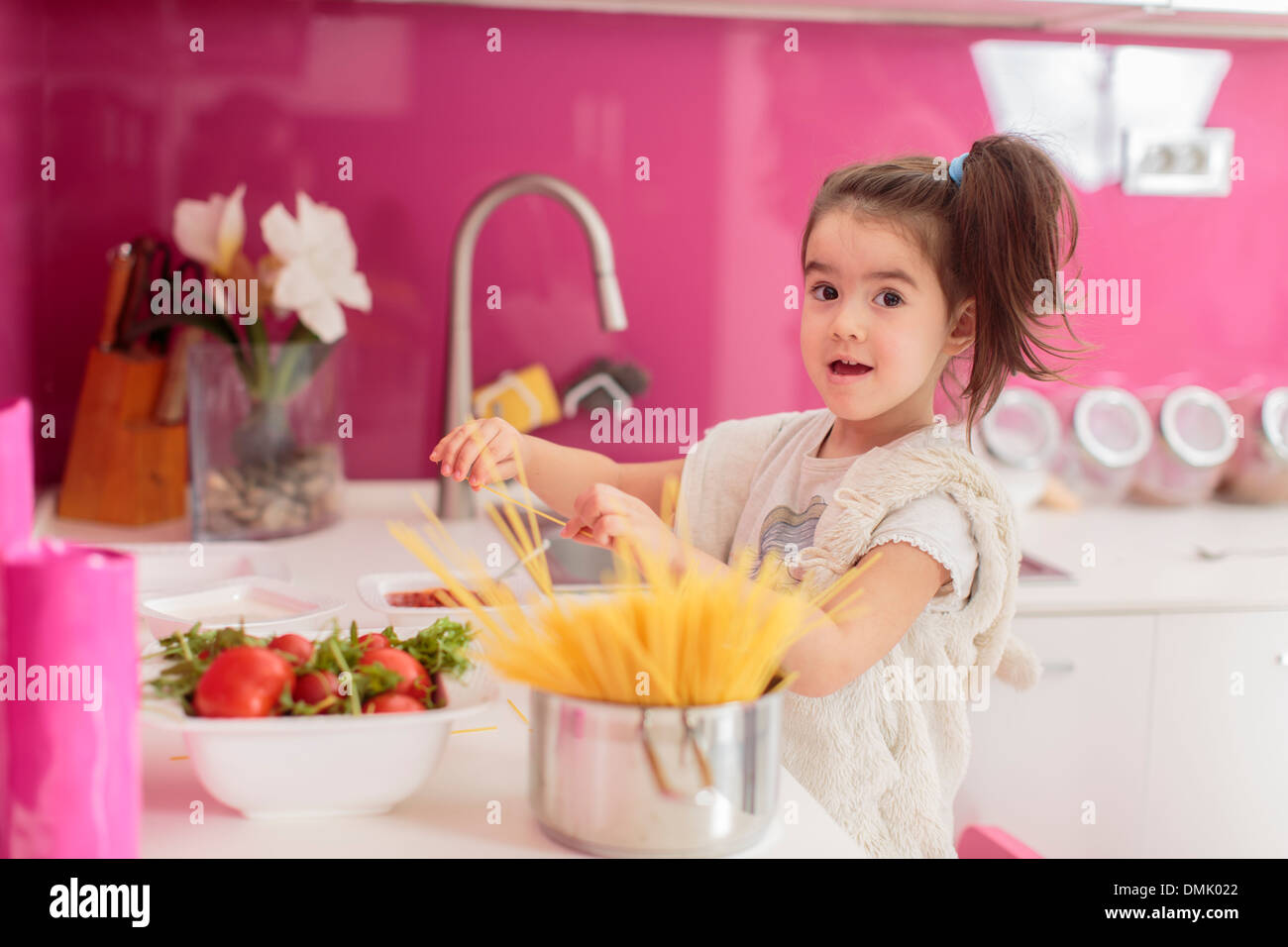 Little girl in the kitchen Stock Photo