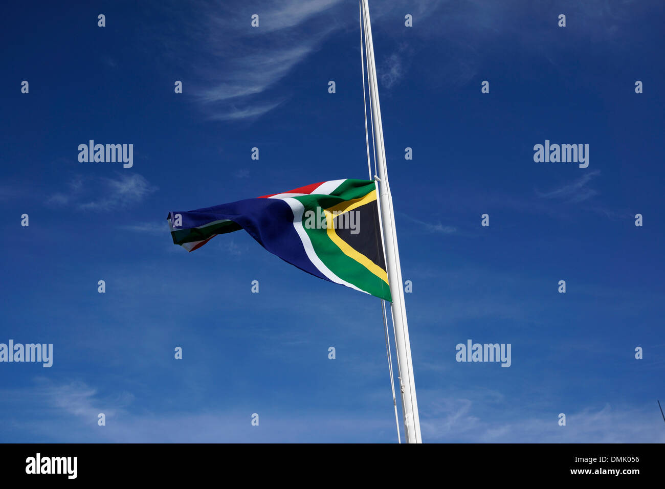The South African flag flying at half mast in front of the House of