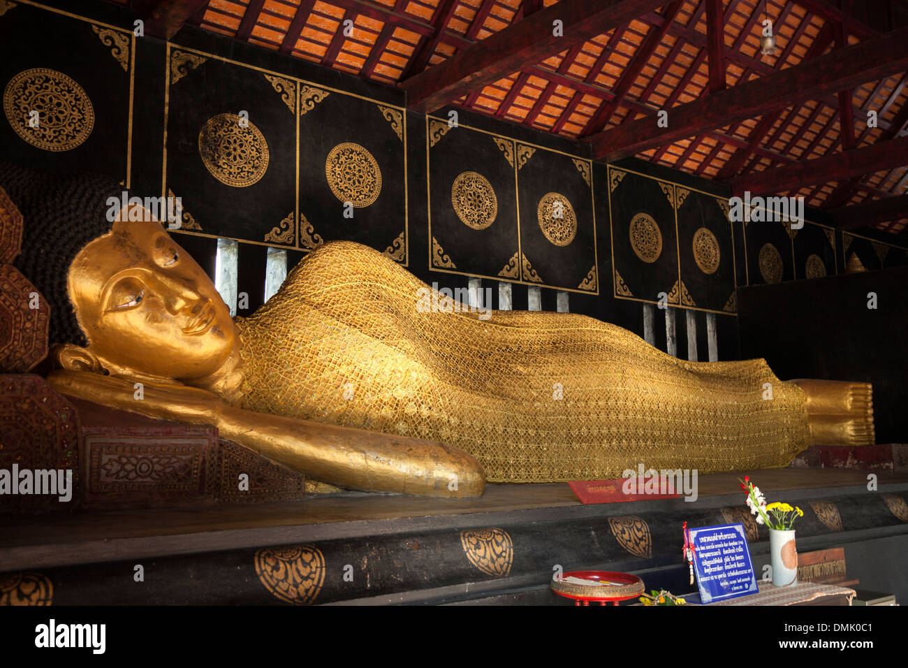 In Chiang Mai (Thailand), a remarkable reclining Buddha which can be seen in a chapel of the Chedi Luang temple precincts. Stock Photo