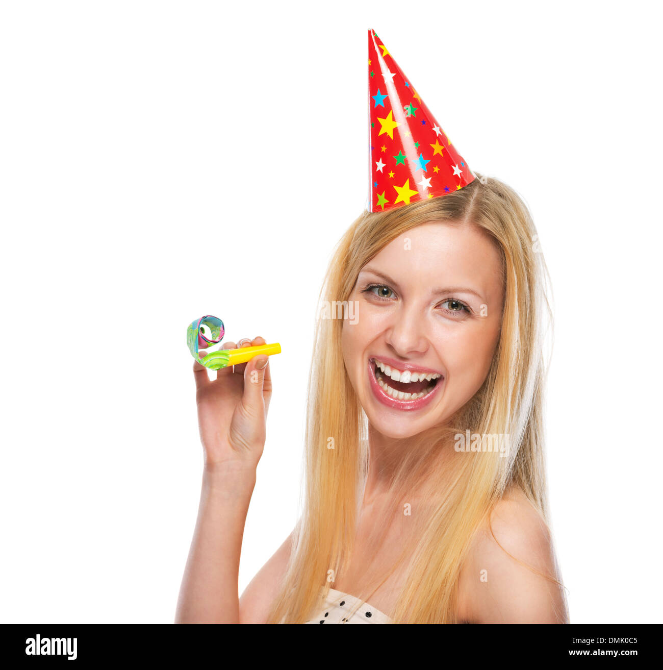 Portrait of smiling teenage girl in cap party horn blower Stock Photo