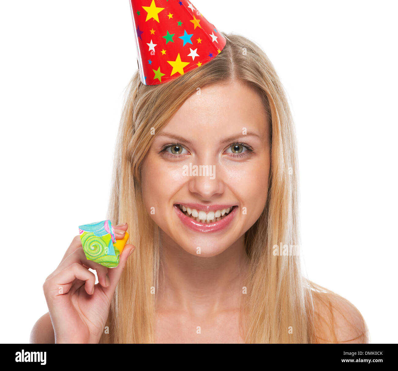 Portrait of smiling teenage girl in cap party horn blower Stock Photo ...