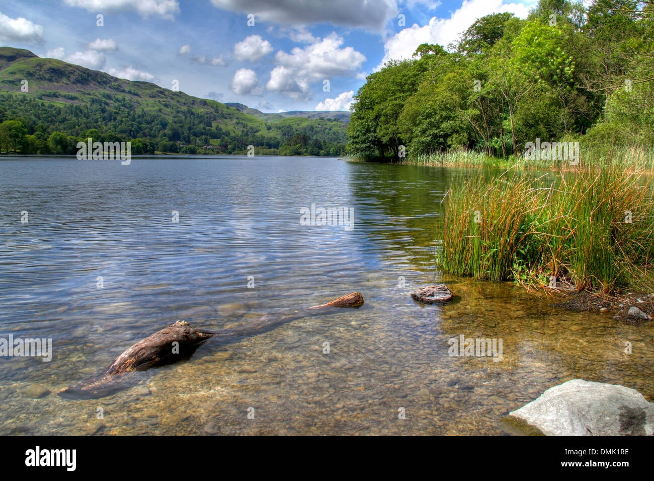 The clear waters at Grasmere, the Lake District, Cumbria, England. Stock Photo