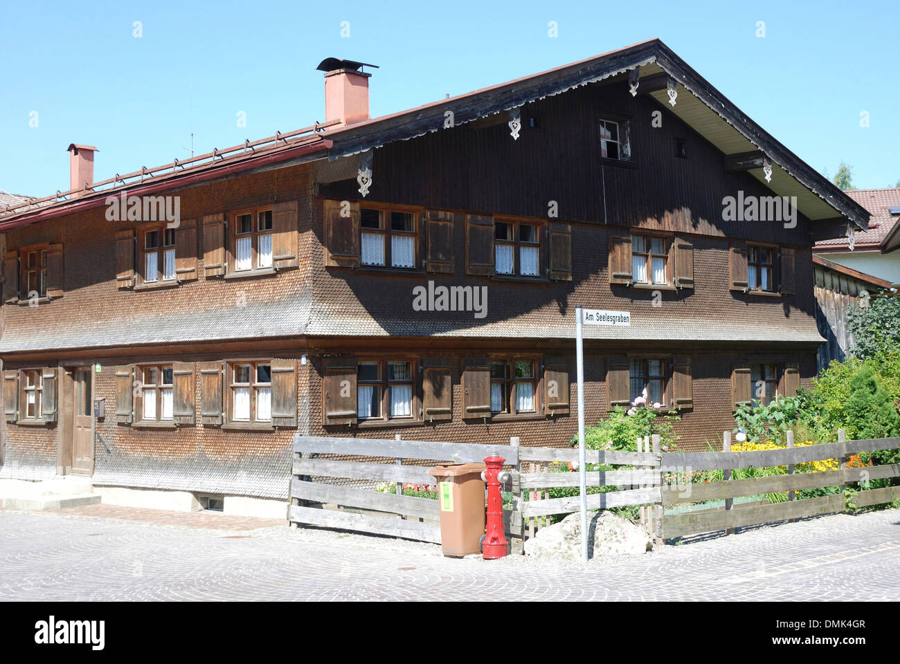 Allgaeu farmhouse from the 19th Century in Oberstaufen. Stock Photo