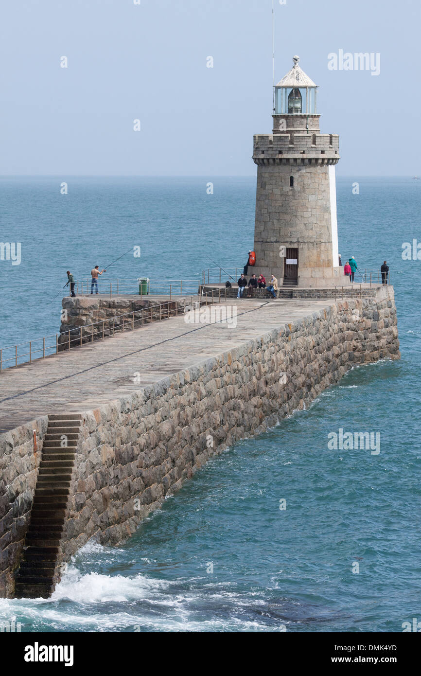 JETTY AND LIGHTHOUSE ON SAINT PETER PORT, GUERNSEY, CHANNEL ISLANDS Stock Photo