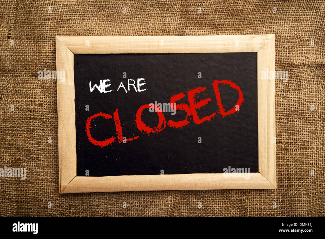 We are closed note on black message board Stock Photo
