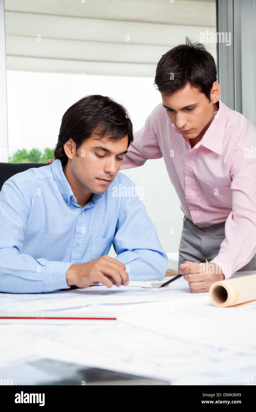 Architects Discussing Work Stock Photo