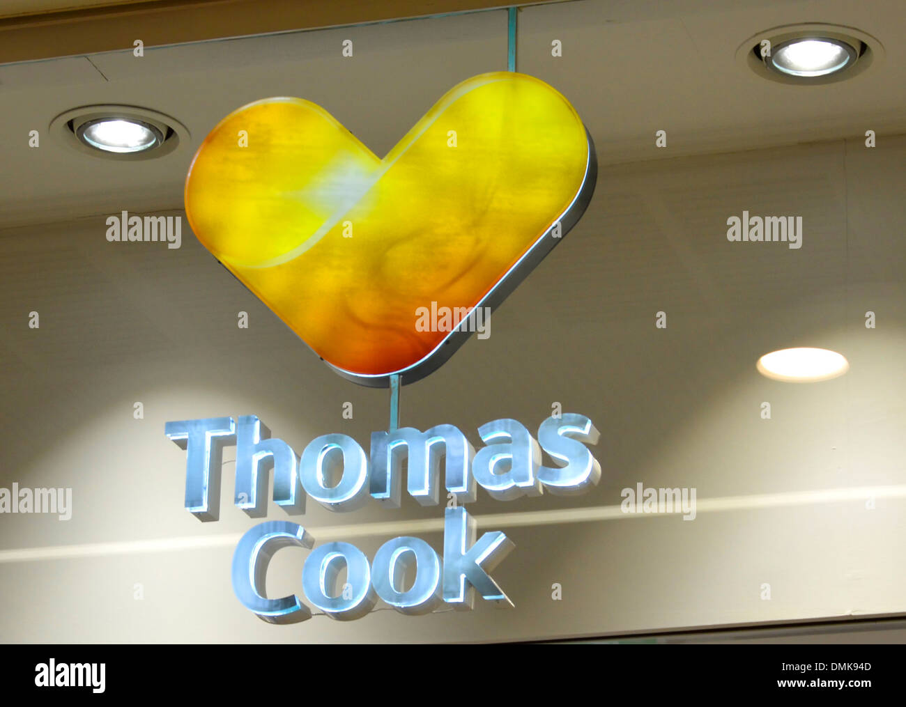 Close up of new Thomas Cook travel agents corporate logo above shop unit in shopping mall (see also Alamy DMK94C) Stock Photo