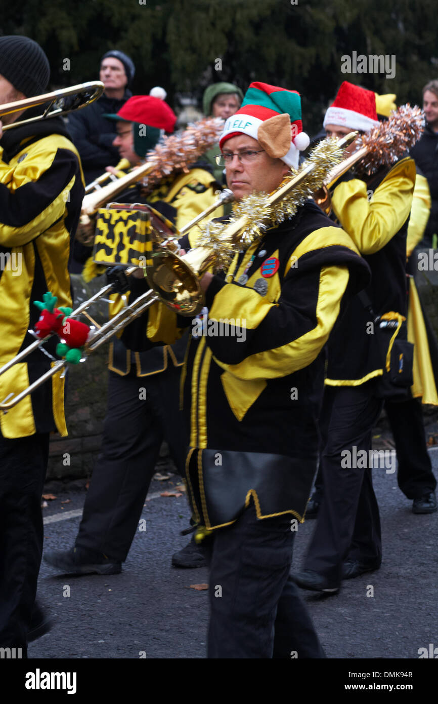 Wimborne, Dorset, UK. 14th December 2013. Crowds turn out to watch the 25th Wimborne Save The Children Christmas Parade. Gugge 2000, Gugge2000, Swiss style guggemusik band marching band. Credit: Carolyn Jenkins/Alamy Live News Stock Photo