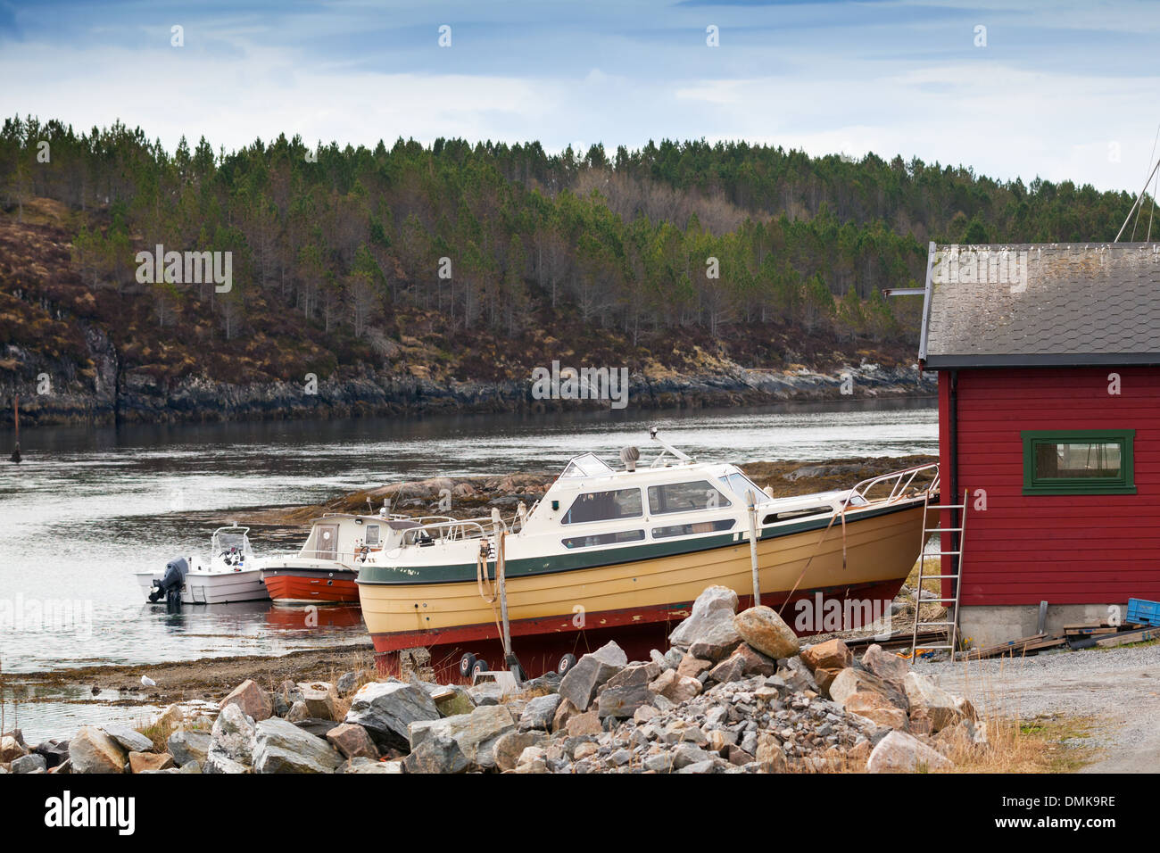 Small motor boats stand on the coast in Norway Stock Photo
