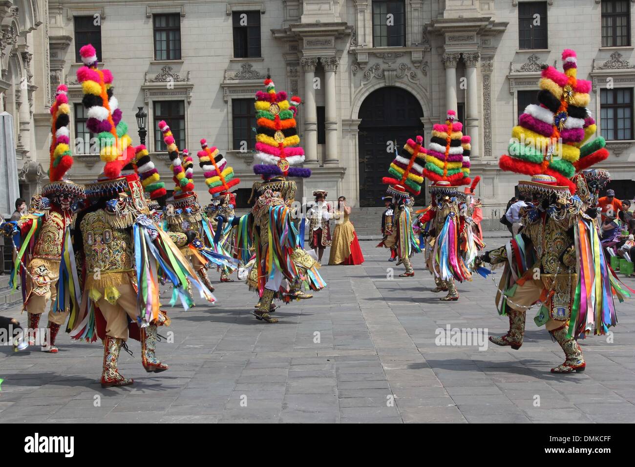 Lima, Peru. 14th Dec, 2013. Dancers dressed as the 'Truco y la Dama', perform in the honor yard of the Government Palace, in Lima City, capital of Peru, on Dec. 14, 2013. The dance of 'Los Negritos' or 'Cofradia de los Negritos', traditional dance of the Christmas season in the city of Huanuco, was declared as Cultural Heritage in August 2005. Credit:  Luis Camacho/Xinhua/Alamy Live News Stock Photo