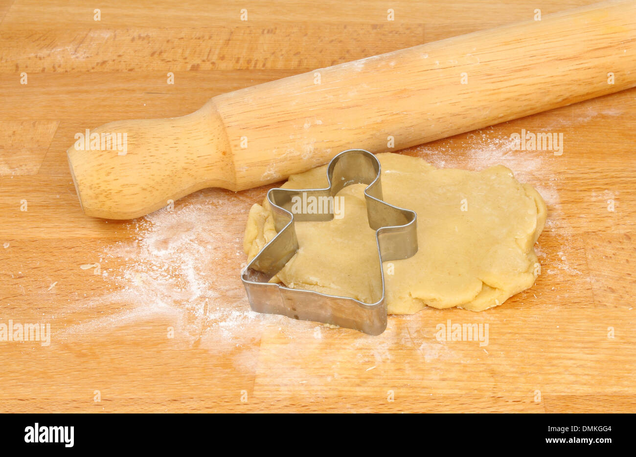 Angel Shortbread Shortbread dough with a Christmas angel cutter and rolling pin on a ...